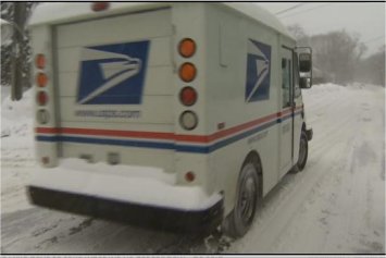 Video: Snow banks present challenges for postal carriers