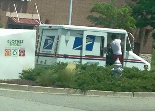 Video: Woman snaps pic of postal worker appearing to steal toy donations