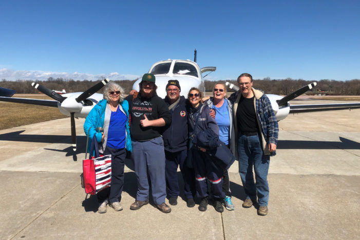 Postal employees rescued from flooded town